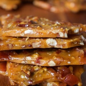 bourbon bacon brittle pieces stacked on a counter