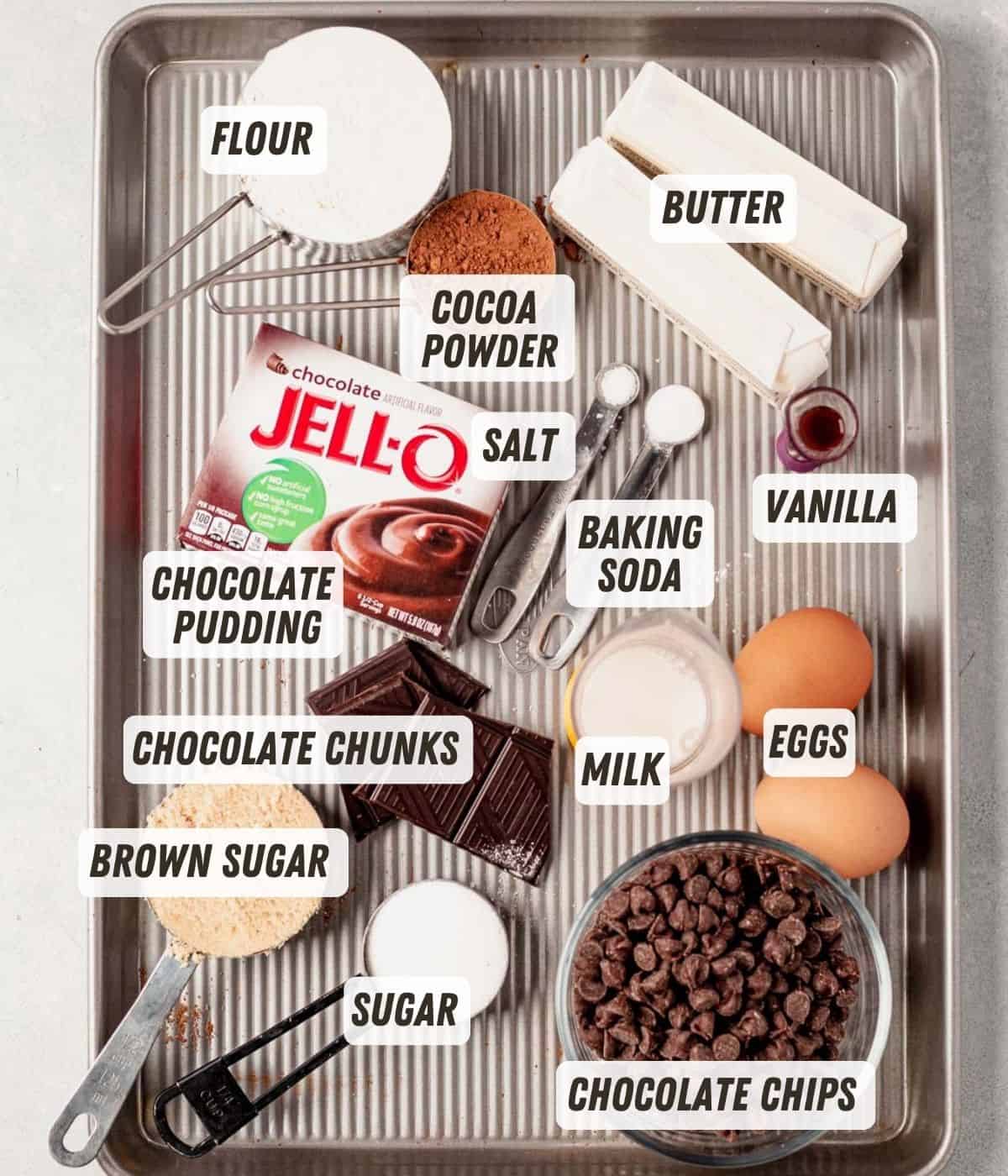 chocolate pudding cookie ingredients on a baking sheet