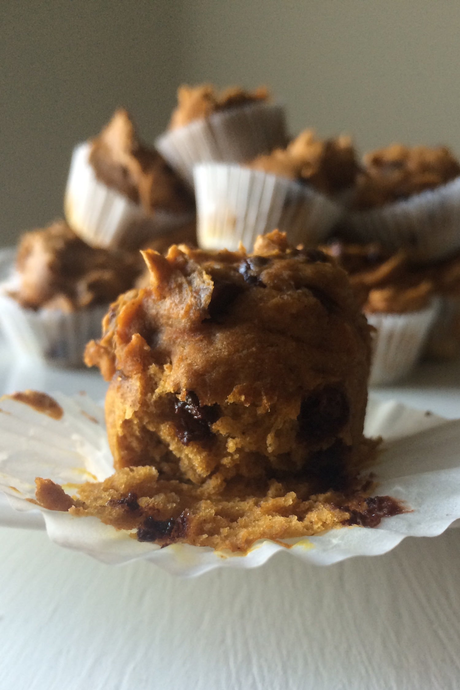 pumpkin chocolate chip mini muffin unwrapped on the table