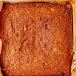 baked gluten free banana cake in a square baking dish