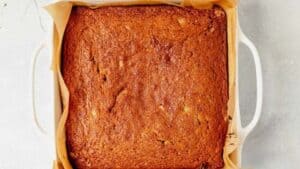 baked gluten free banana cake in a square baking dish