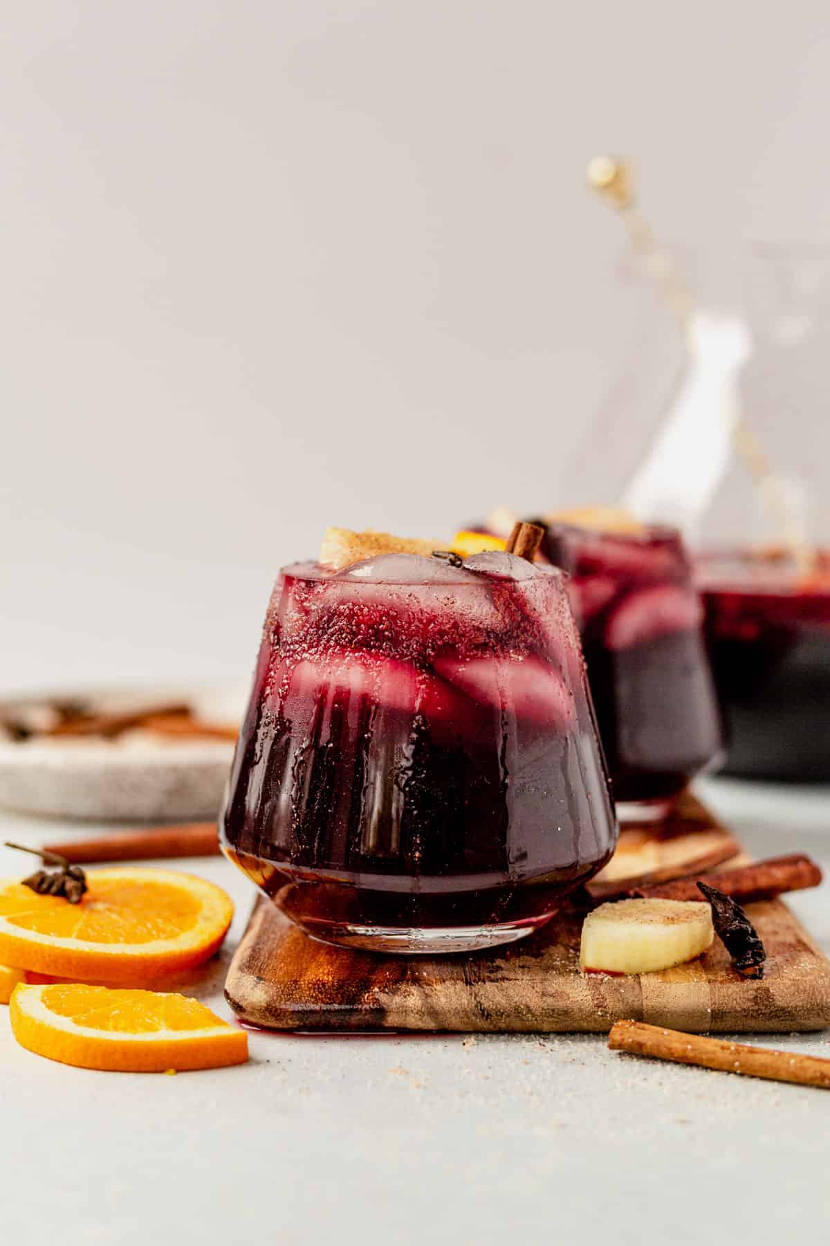 a glass of thanksgiving sangria in a wine glass with cinnamon sugar rim