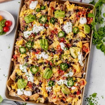 sheet pan breakfast nachos loaded with toppings