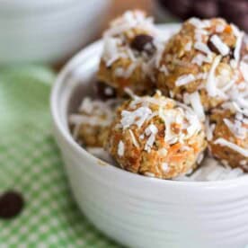 carrot cake energy balls in a white bowl on a table cloth