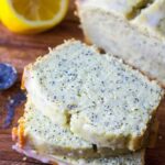 lemon poppy soda bread on a counter with the first few slices cut