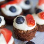 bite sized patriotic brownie with white icing and fresh berries on top