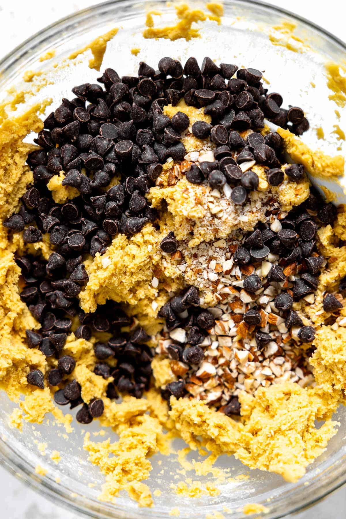 rocky road cookie dough with chocolate chips and almonds in a bowl