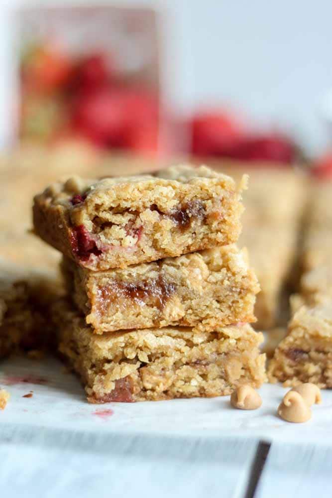 The classic blondie turned peanut butter and jelly just in time for school to start! These peanut butter and jam filled blondies are soft, chewy and a perfectly sweet back-to-school dessert or snack.