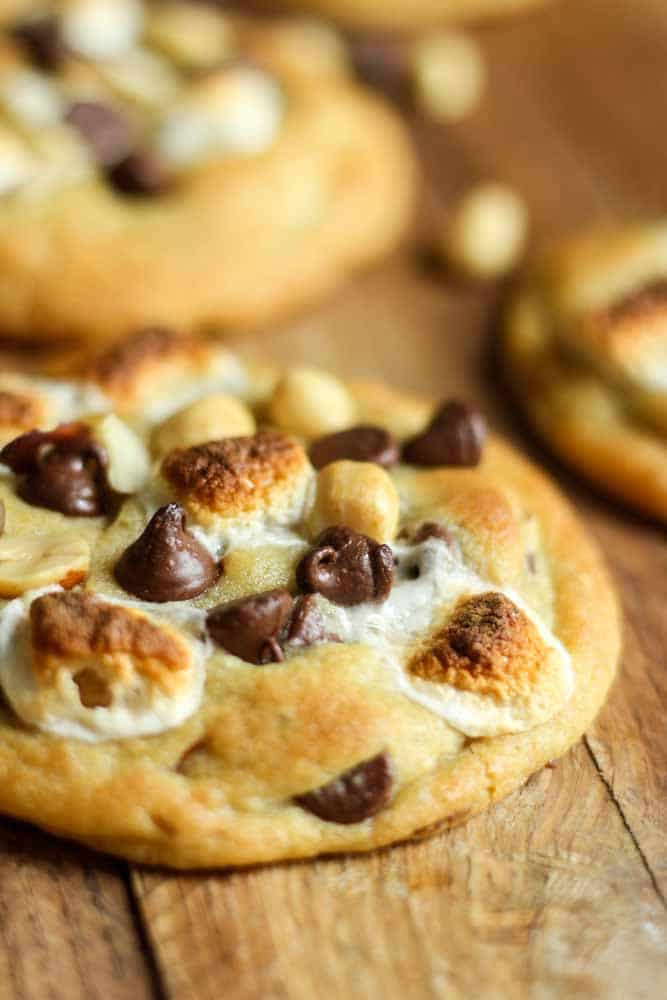 rocky road cookie sitting on a table with toasted marshmallows on top