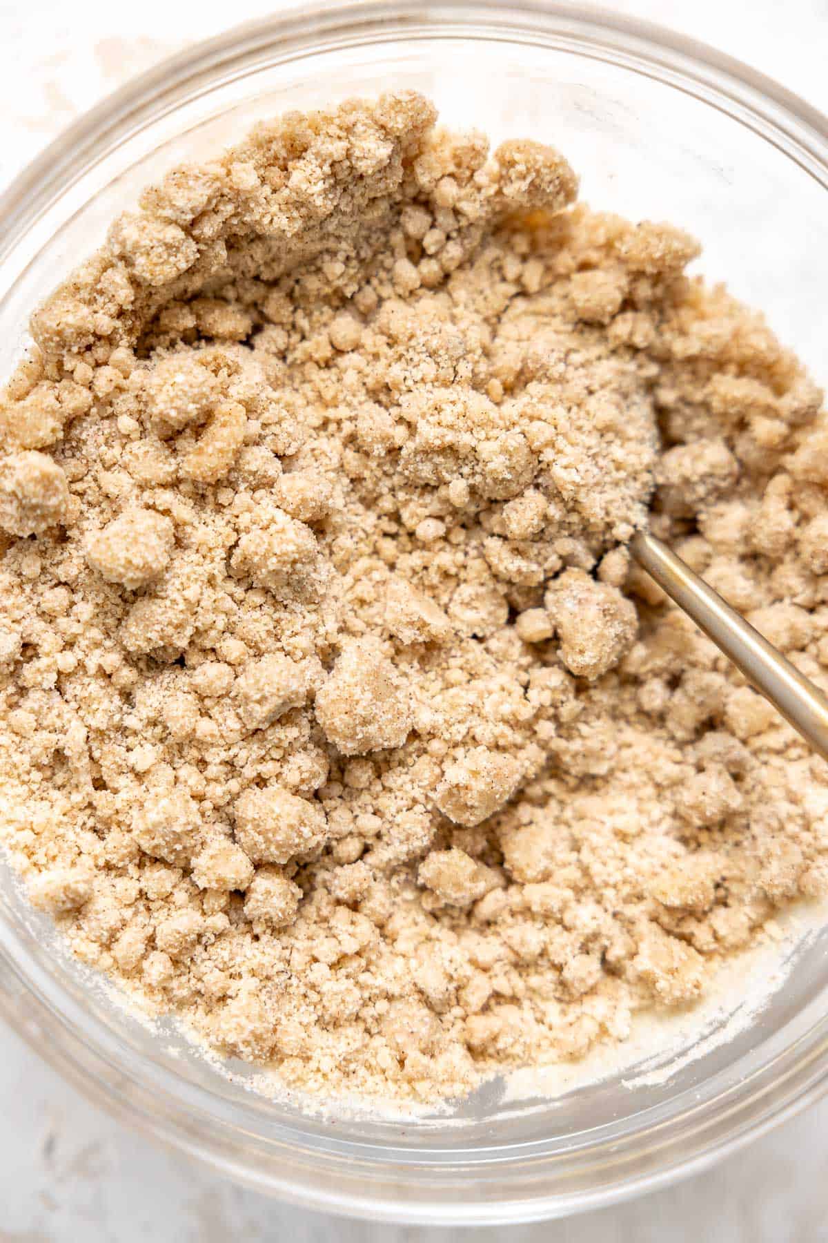 streusel topping in a glass mixing bowl.