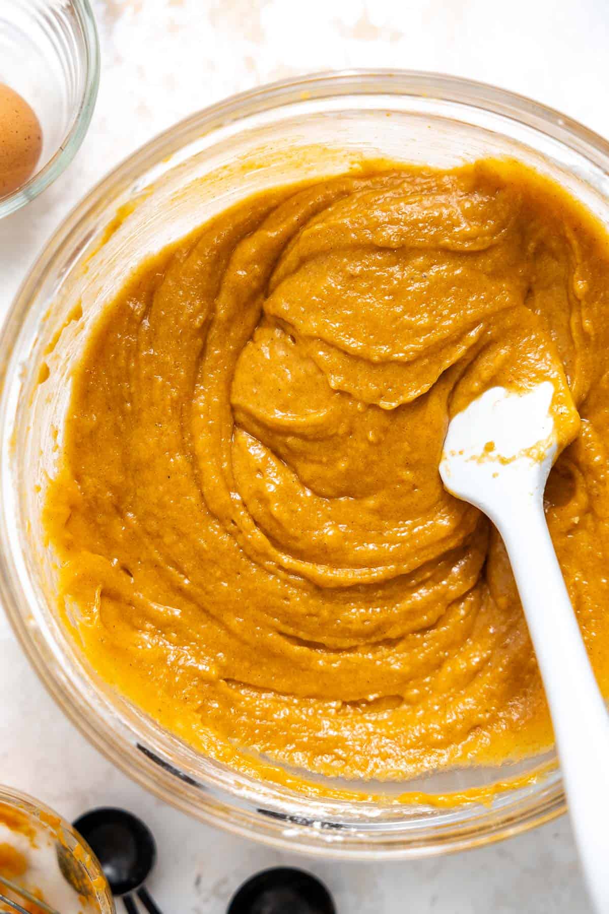 pumpkin muffin batter resting in a bowl.