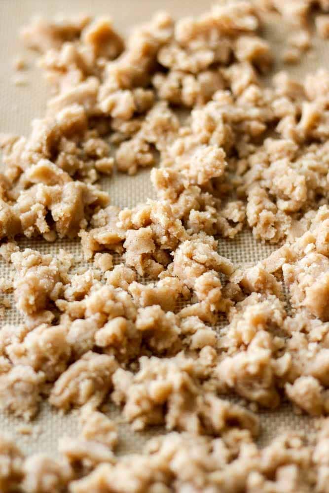 cinnamon crumble topping for pumpkin streusel muffins laid out on a baking mat