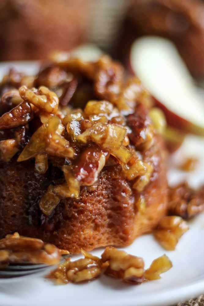 You will love these caramel apple mini cakes! This dessert recipe is easy to make and so moist. It's topped with chopped apples and pecans and so much caramel. Serve with a big scoop of ice cream!