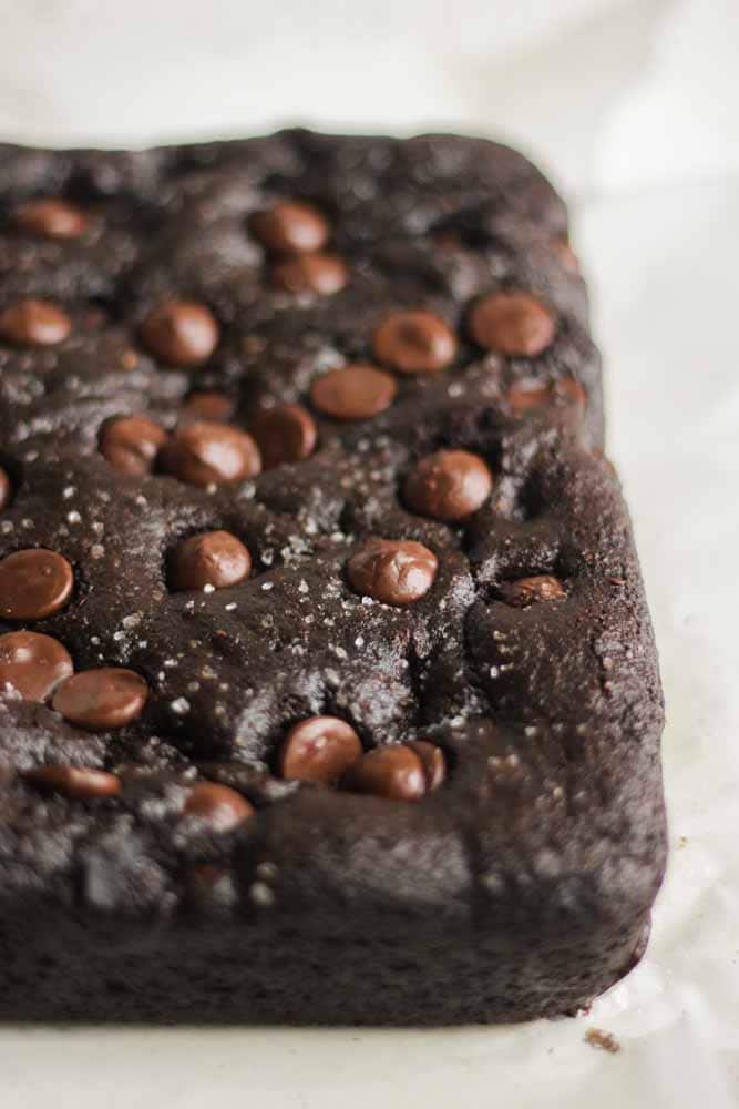 Thick and chewy, these paleo chocolate salted cookie bars are an easy dessert recipe that's guilt free and filled with lots of paleo chocolate.