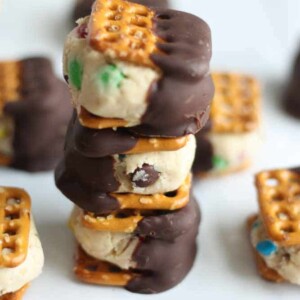 three monster cookie bites stacked on top of each other on a counter