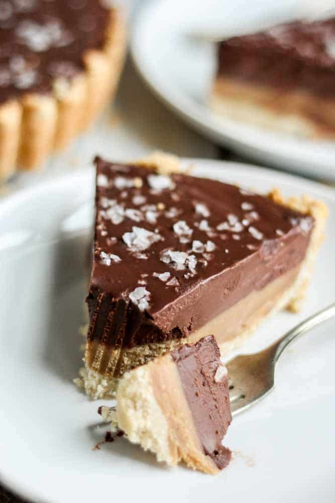This chocolate caramel tart is paleo, gluten-free and vegan! Made with whole natural ingredients, this tart recipe is naturally sweet and satisfying.