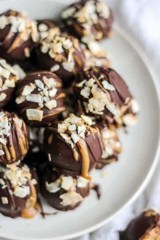 Paleo samoa truffles are an easy to make and guilt free dessert recipe. They're vegan, whole 30 and paleo and come together for a simple sweet treat.