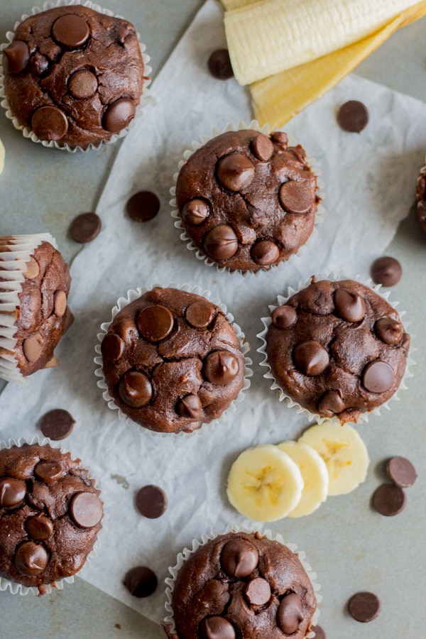 Healthy chocolate banana blender muffins! This muffin recipe is easy to make and gluten free. Mix the dry ingredients then blend all of the wet ingredients together. Fold in chocolate chips and bake until melted and gooey. They're also made with coconut oil and greek yogurt. They're the perfect magical chocolate muffin and so guilt free.