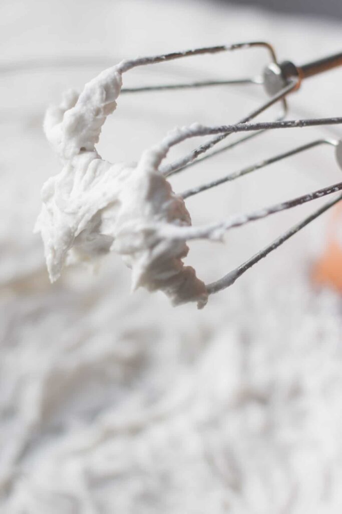 coconut cream whipped cream on the ends of a mixer