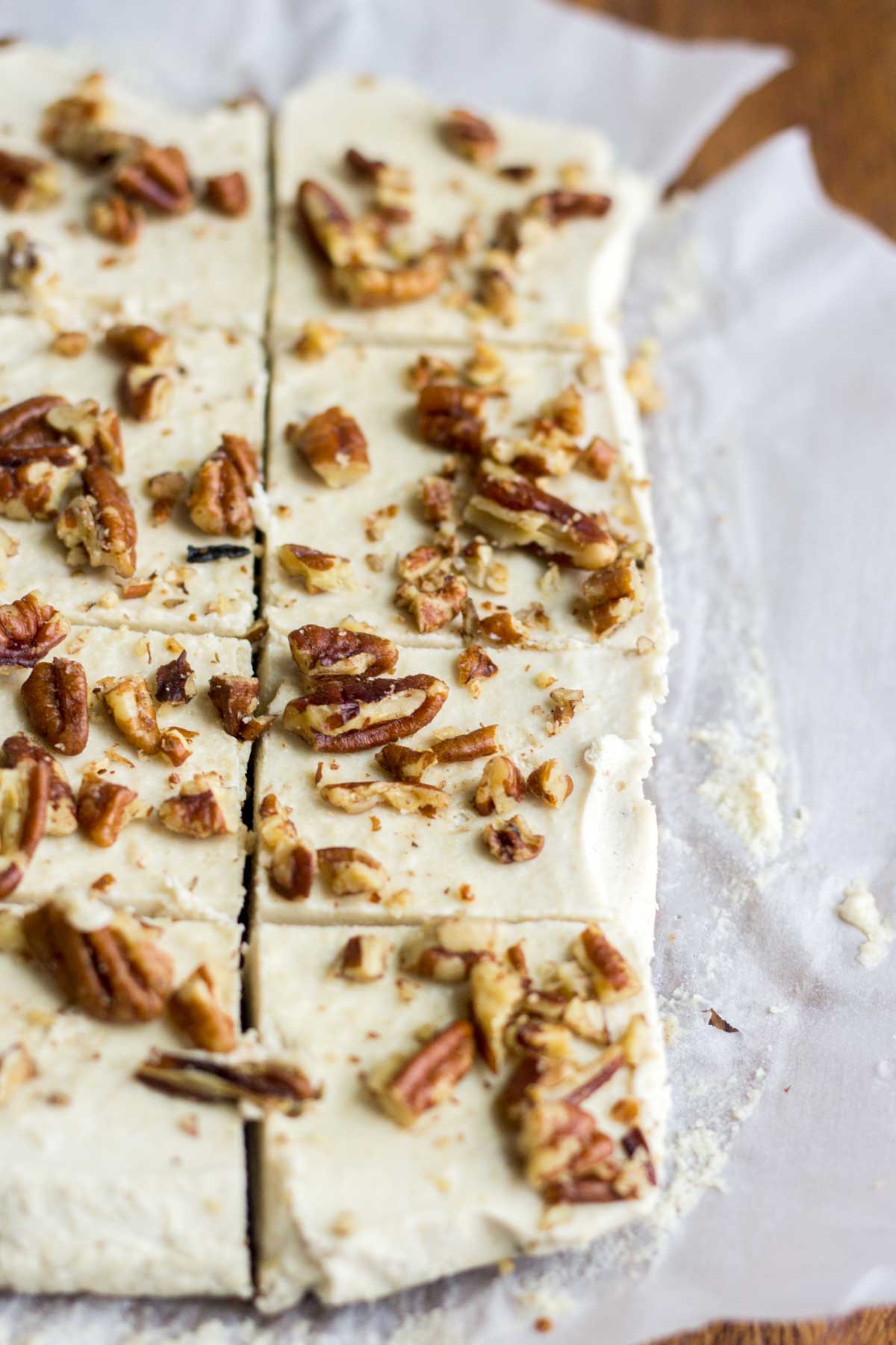 Smooth and creamy, these turtle vegan cheesecake bars are an easy and no bake healthy dessert. The crust is made with pecans and dates and the silky vegan cheesecake is topped with paleo caramel and pecans. You won't believe how yummy an easy it is to make!