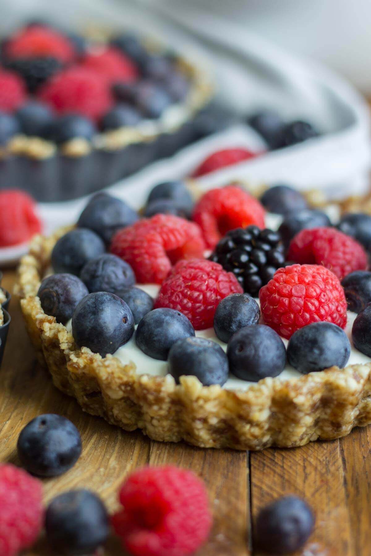 mini greek yogurt fruit tart filled with fresh berries