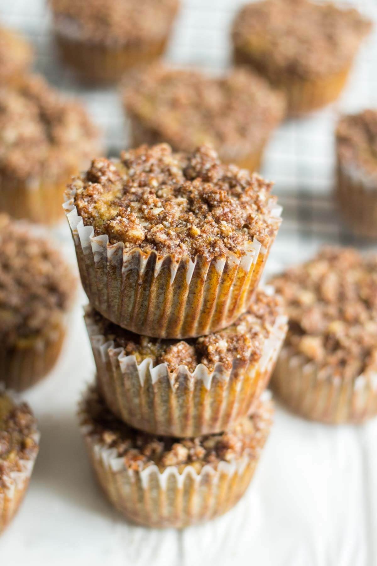 The best Easter recipe, these paleo cinnamon streusel carrot muffins have a layer of pecan and cinnamon topping piled on top. The carrot muffin base is filled with carrots and more cinnamon and sweetened with ripe bananas. This recipe is so moist and flavorful! You're friends and family won't even know it's paleo and gluten-free on Easter morning!