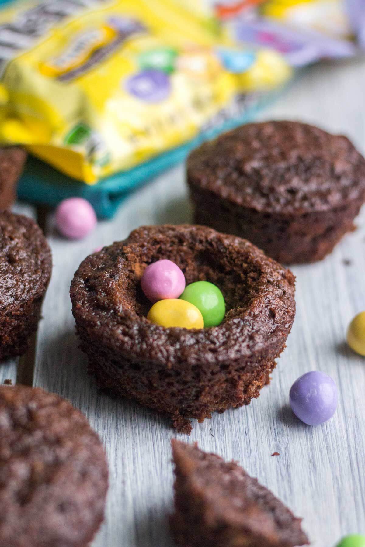 Light and fluffy chocolate cupcakes are topped with a sweet and creamy peanut butter frosting. Plus, there's a fun Easter surprise on the inside! These Chocolate Peanut Butter Piñata Cupcakes will surprise and delight all of your friends and family.