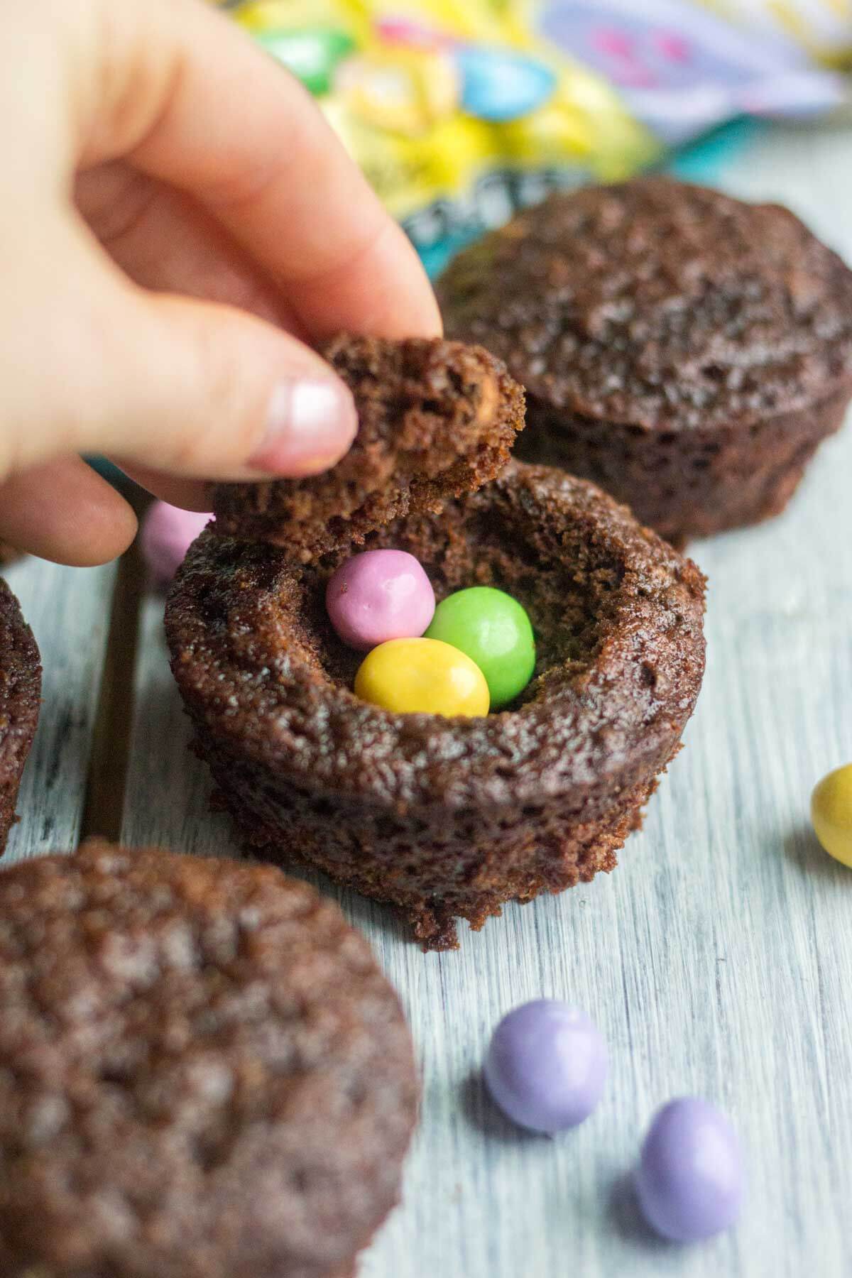 Light and fluffy chocolate cupcakes are topped with a sweet and creamy peanut butter frosting. Plus, there's a fun Easter surprise on the inside! These Chocolate Peanut Butter Piñata Cupcakes will surprise and delight all of your friends and family.