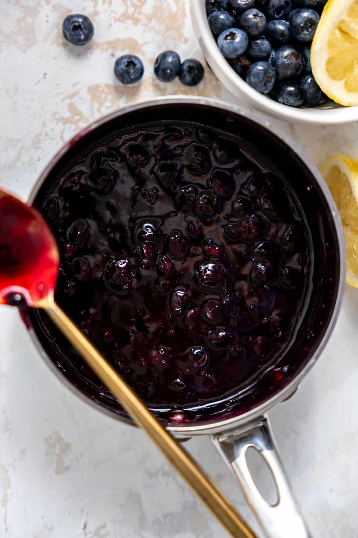 blueberry filling simmering in a saucepan.