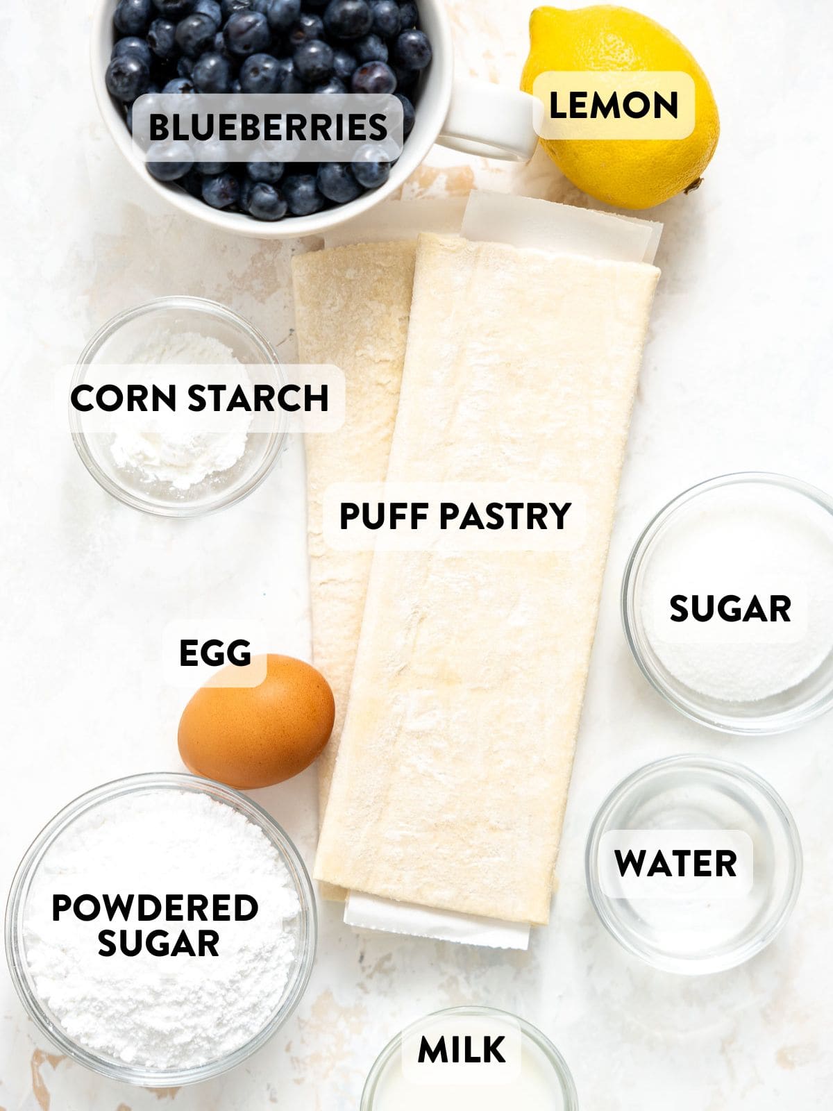 blueberry puff pastry ingredients on a countertop.