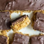 These healthy scotcharoos are a lightened up version of the classic recipe. They're gluten-free and refined sugar-free but you wouldn't notice at all! They're the healthy option when you are craving the sweet treat!