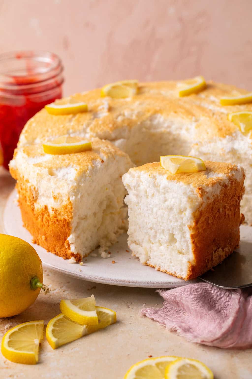 a slice being taken out of lemon angel food cake