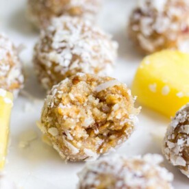 Healthy and filled with energizing ingredients, these pina colada energy bites are a sweet and healthy snack that will keep you satisfied all day. It's made with raw ingredients like cashews and macadamia nuts, plus dried fruit and coconut. This energy bite recipe will transport you to the beach!
