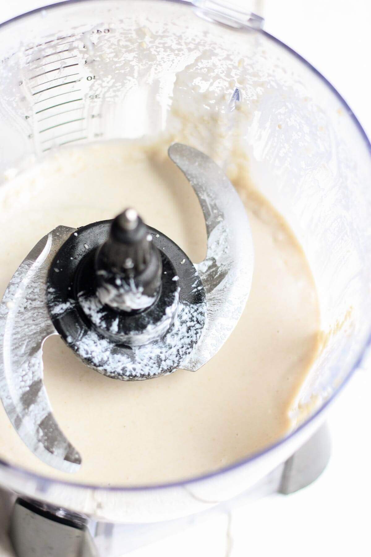 creamy layer of Strawberries and Cream Vegan Popsicles in a food processor