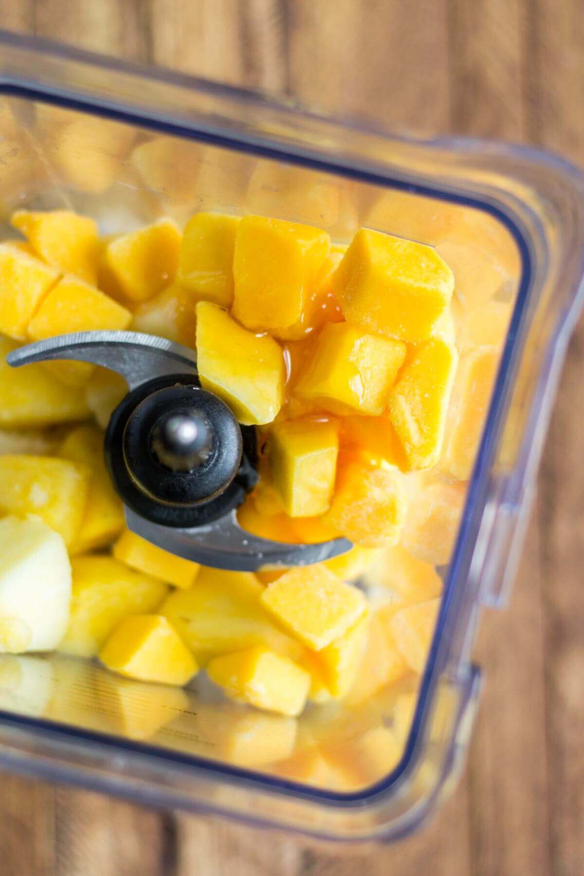 banana coconut smoothie bowl ingredients in a blender