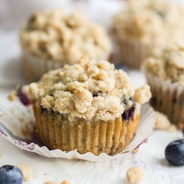 Easy blueberry muffins make for a delicious start to the day! This recipe is filled with blueberries and topped with a cinnamon crumble topping.