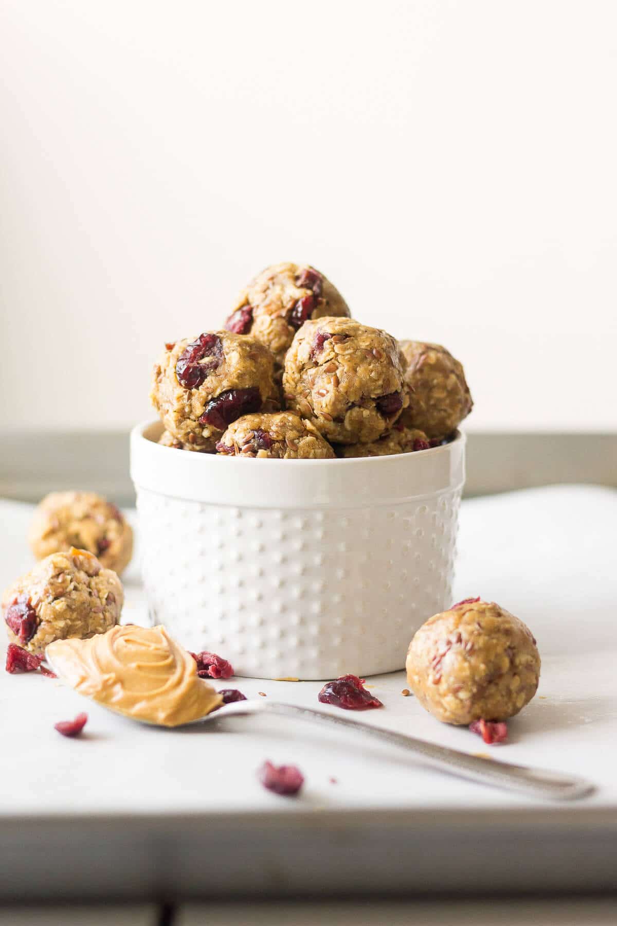 PB & J Protein Balls stacked in a white ramuken