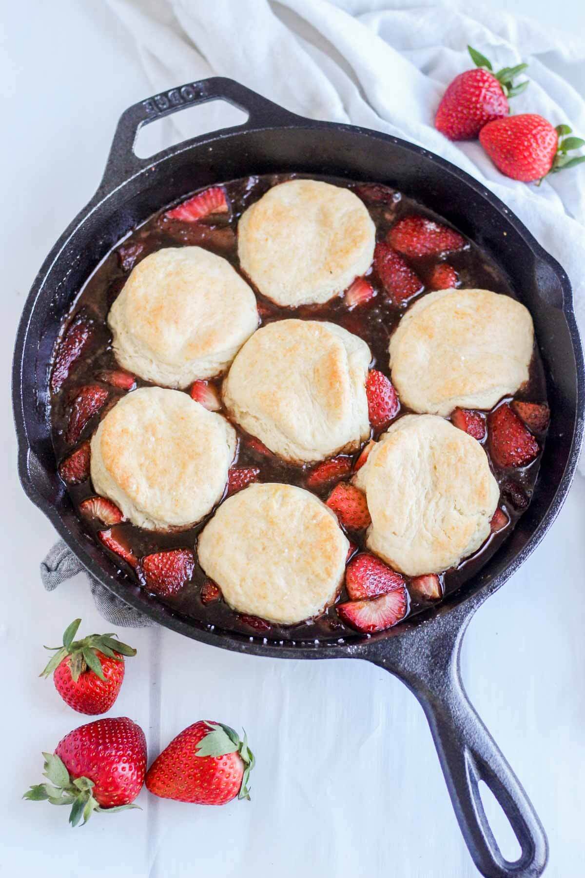 roasted strawberry cobbler in a cast iron skillet