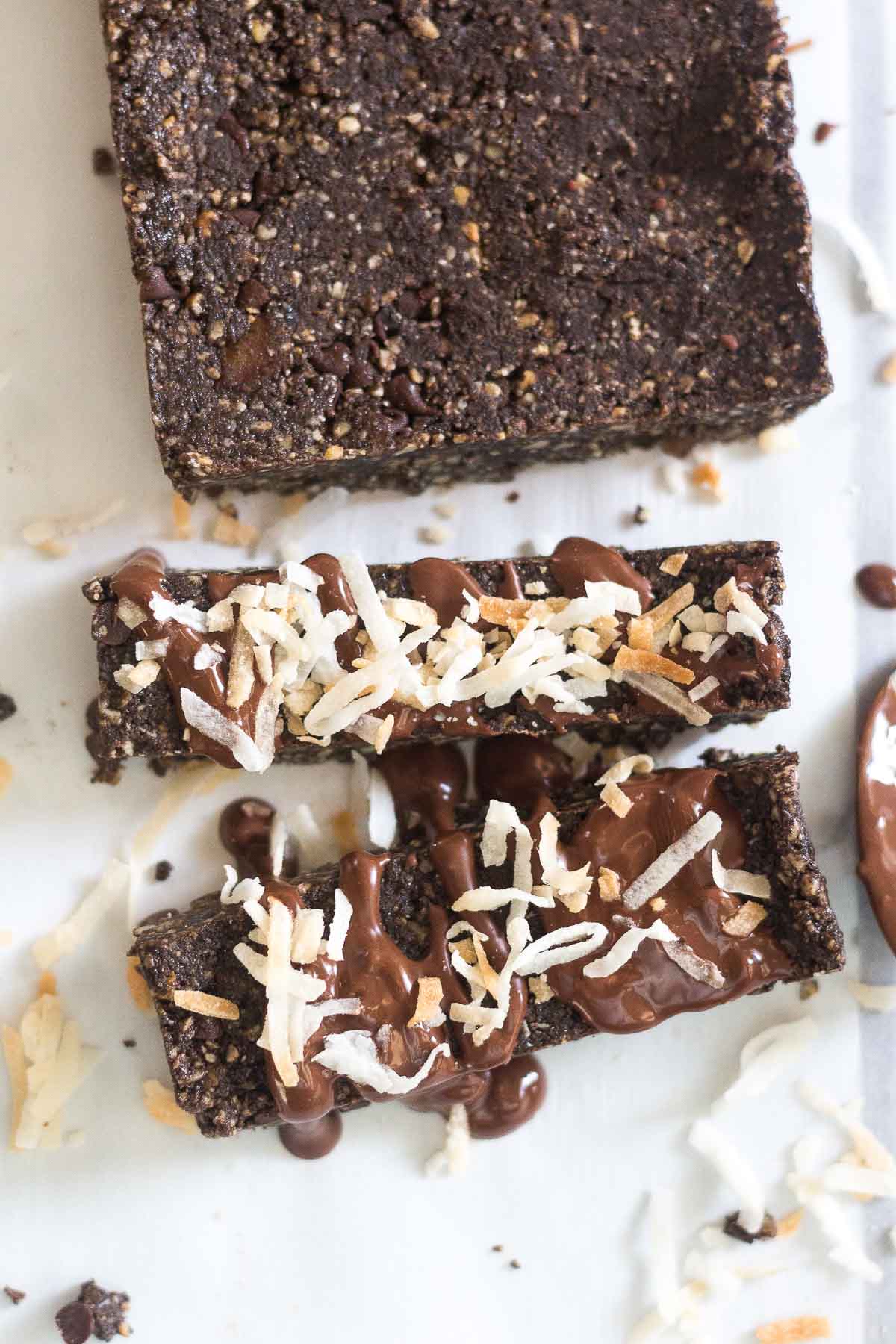 coconut protein bars with melted chocolate and toasted coconut