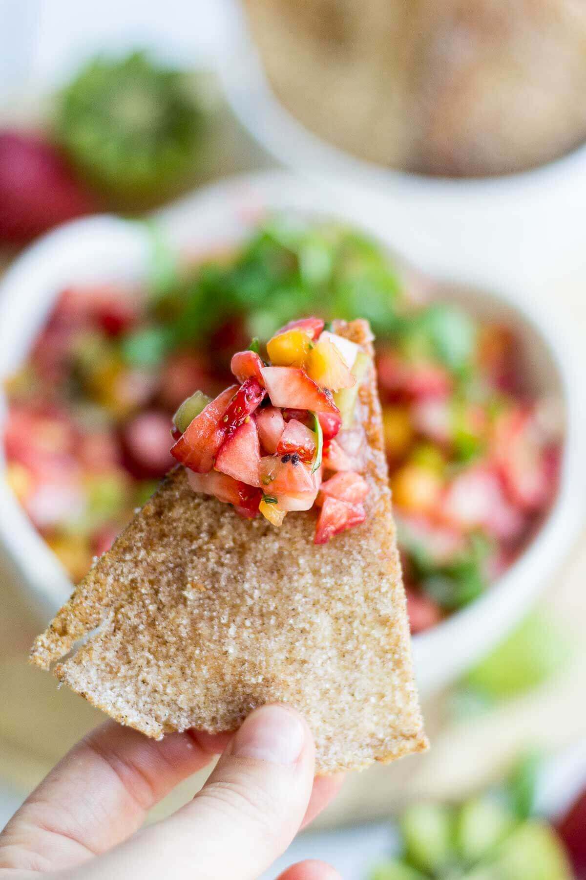 Sweet and healthy at the same time, this fruit salsa is made with fresh fruit and scooped up with a crunchy homemade cinnamon sugar pita chips. This healthy summer dessert means no oven and lots of healthy fruit. You're summer parties will be complete with this healthy recipe.