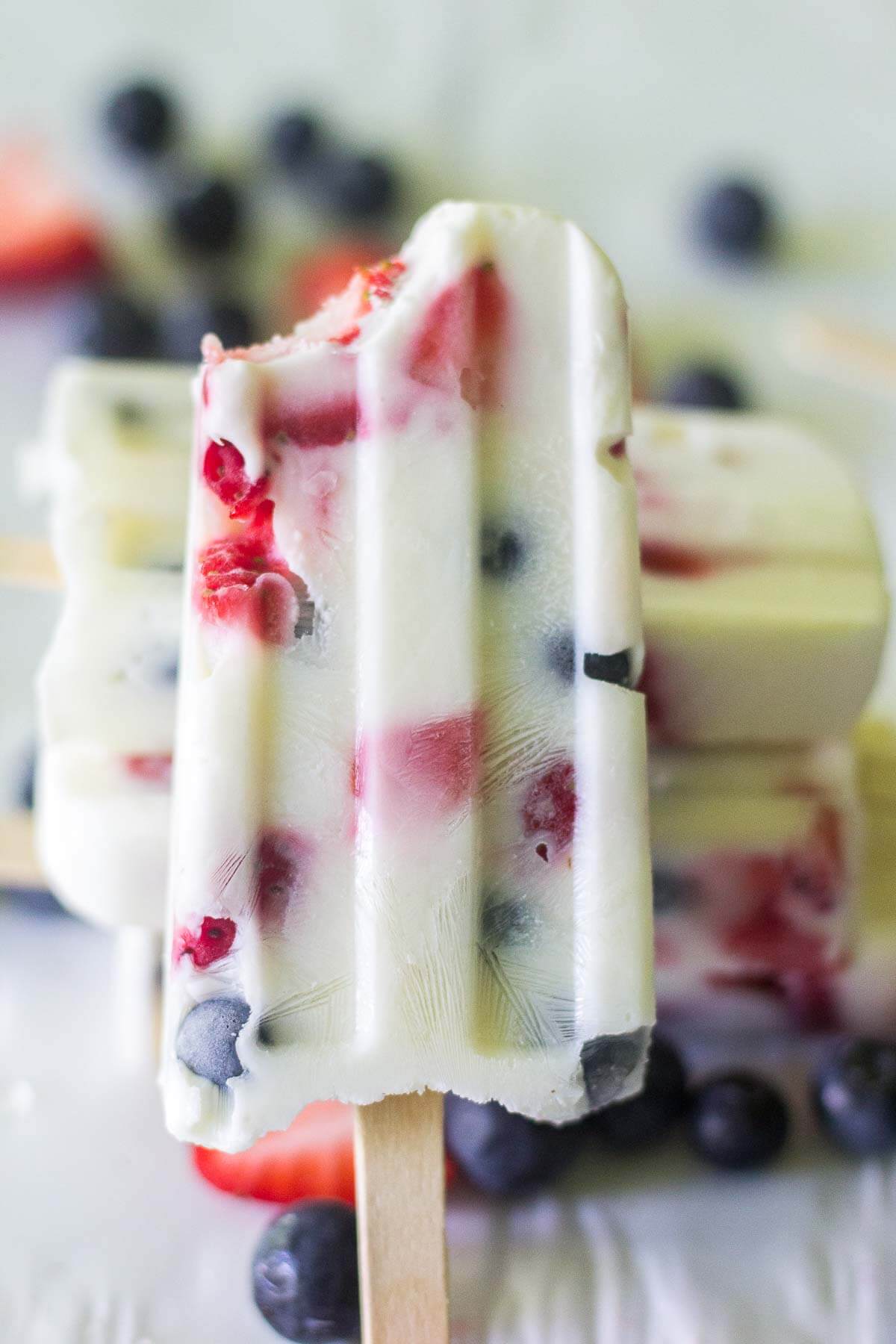 These red, white and blue yogurt popsicles are such a festive and healthy recipe to celebrate 4th of July! With only 3 ingredients, you can make this healthy pops in minutes.