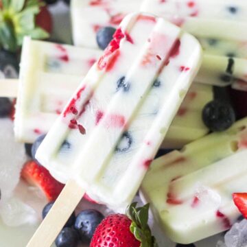 These red, white and blue yogurt popsicles are such a festive and healthy recipe to celebrate 4th of July! With only 3 ingredients, you can make this healthy pops in minutes.