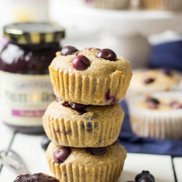 three triple berry blender muffins stacked on top of each other