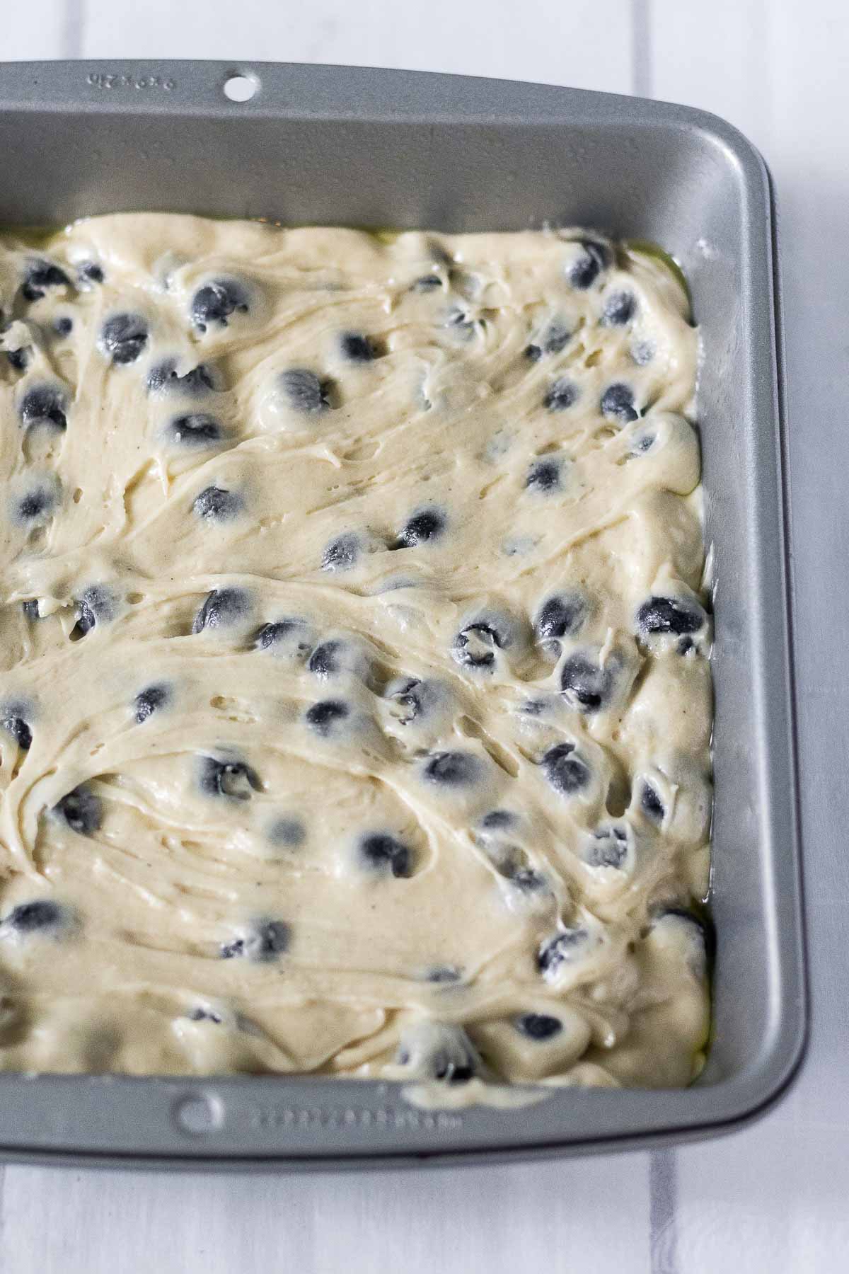 Brown Butter Blueberry Coffee Cake batter in an 8x8 pan