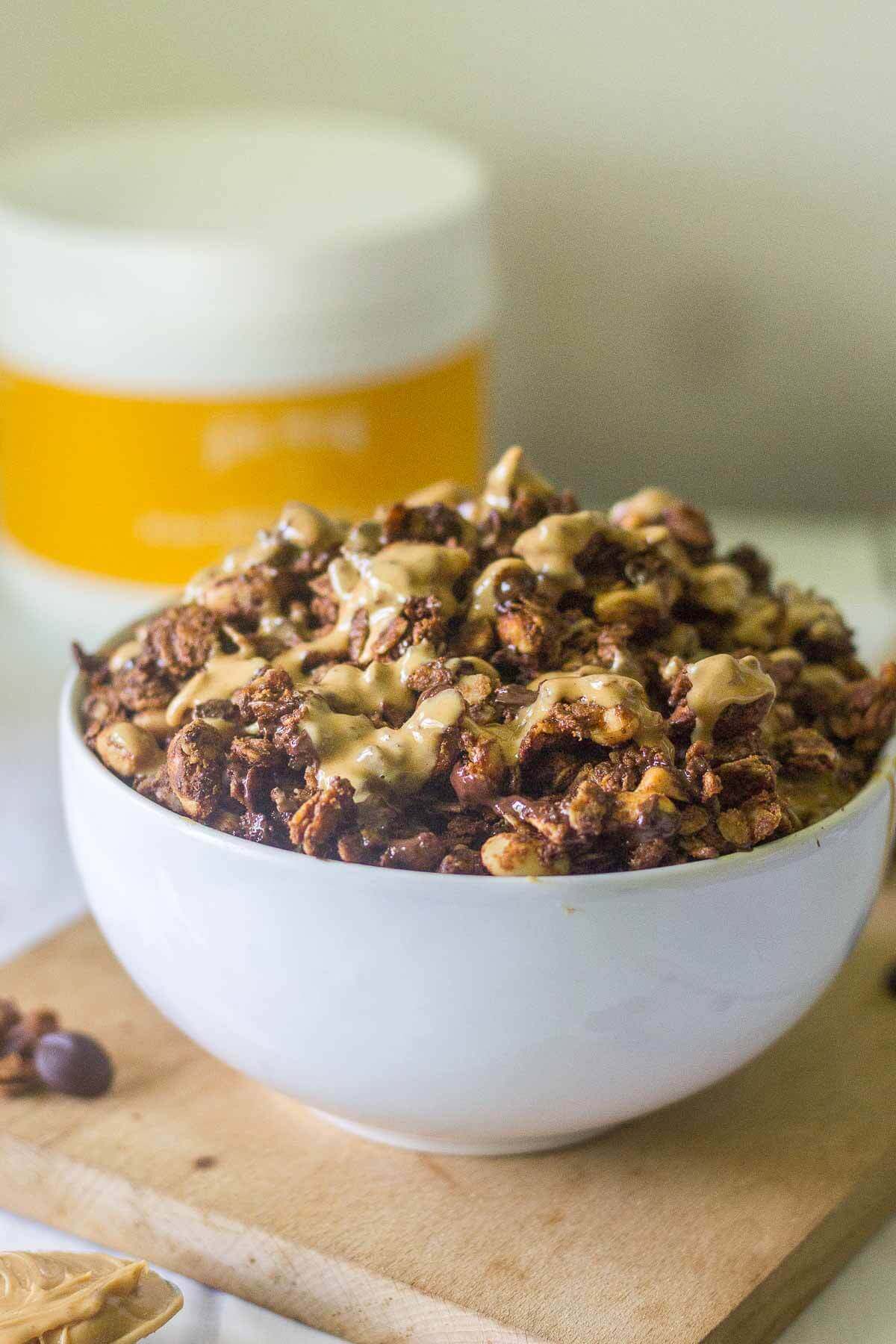 This Chocolate Peanut Butter Protein Granola is crunchy, flavorful and packed with healthy ingredients. It's a delicious way to start the day! The perfect breakfast recipe or snack recipe, this easy granola comes together in minutes and tastes so good.