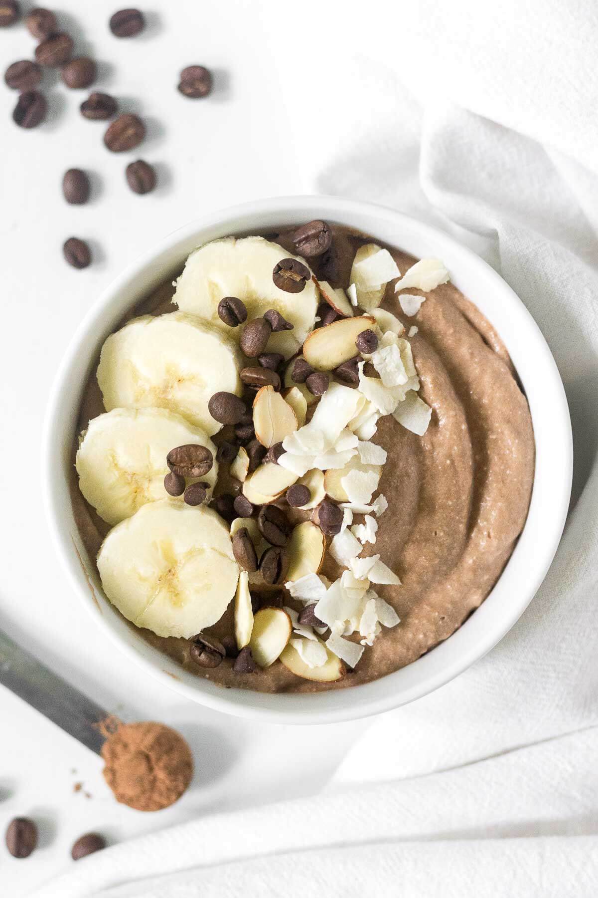 mocha protein smoothie bowl on a counter top