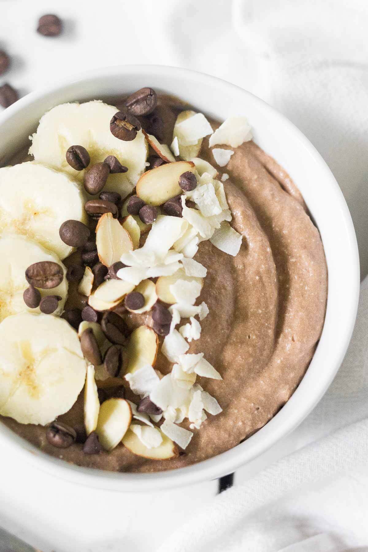 This mocha protein smoothie bowl has all your favorite breakfast flavors in one healthy bowl! It's rich, creamy and filled with chocolate and protein. You will love how easy it is to make!