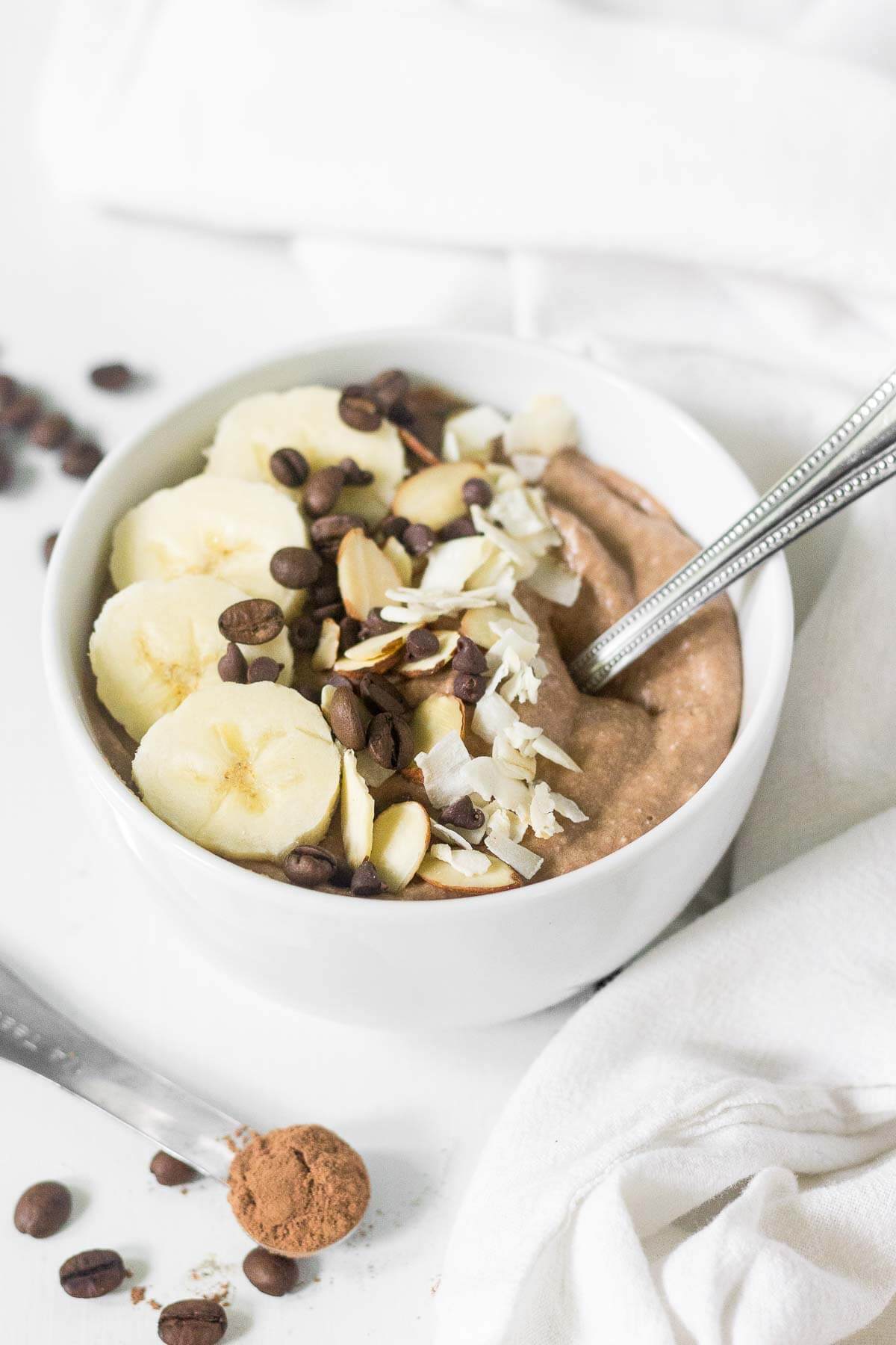 This mocha protein smoothie bowl has all your favorite breakfast flavors in one healthy bowl! It's rich, creamy and filled with chocolate and protein. You will love how easy it is to make!