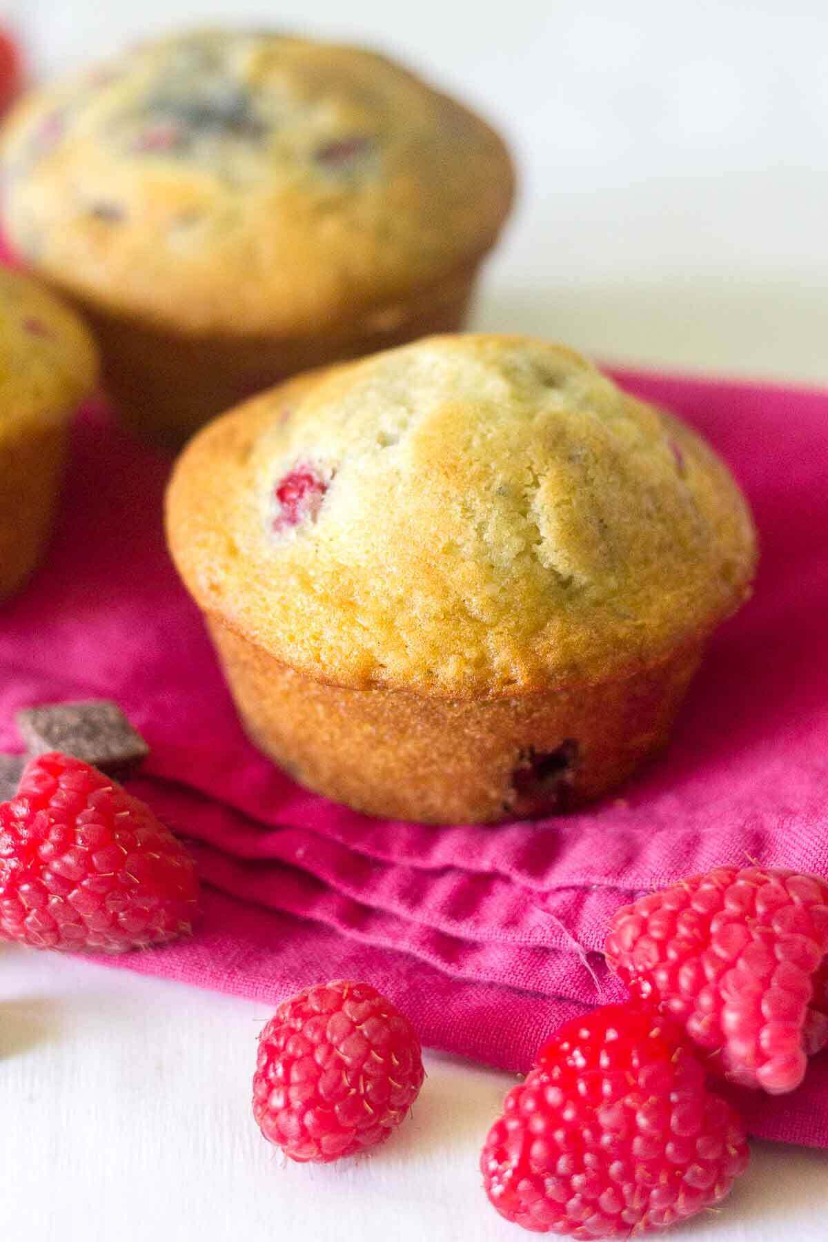 Soft and buttery muffins packed full of yummy ingredients! These Raspberry Chocolate Chunk Muffins will make your next Monday mornings the best yet. The melty chocolate oozes with each bite and the raspberries burst with flavor.