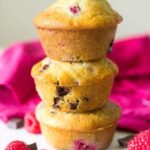 three raspberry chocolate chunk muffins stacked